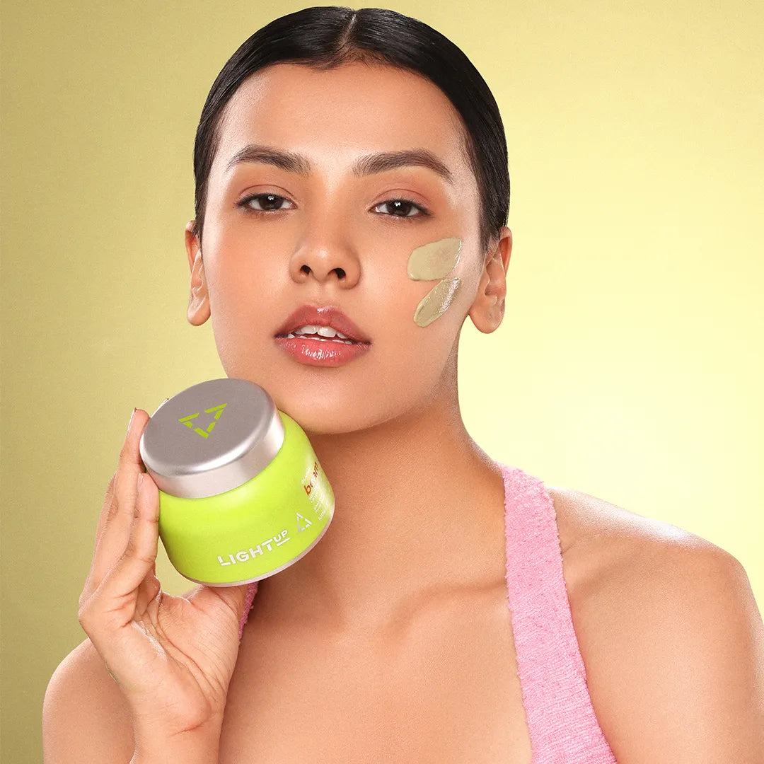 Woman holding clay mask for face